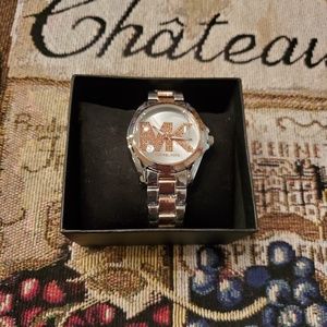 Womens silver and rose gold Michael Kors watch